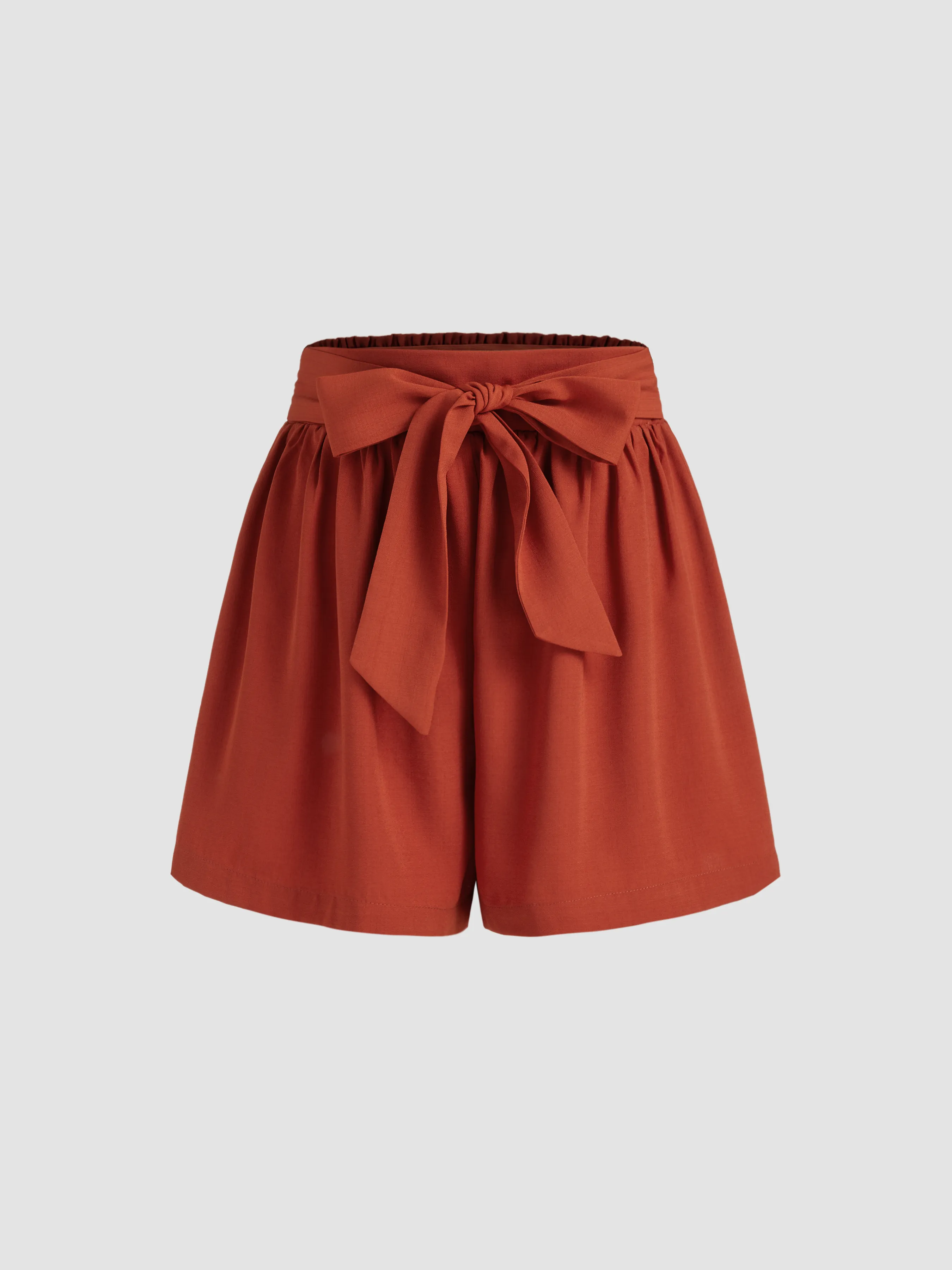 Woven Mid Rise Elastic Waist Knotted Solid Shorts sold by Cider