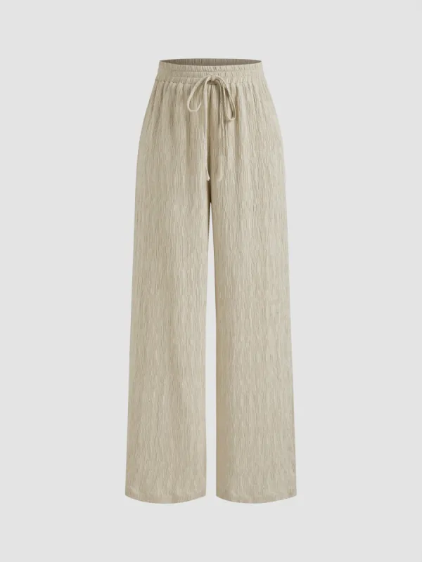 Mid Rise Solid Texture Knotted Straight Leg Trousers  sold by Cider