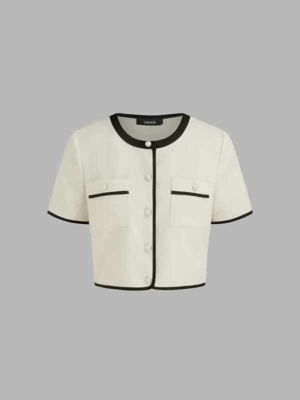 Woven Round Neckline Contrasting Binding Pearl Button Crop Short Sleeve Top  sold by Cider