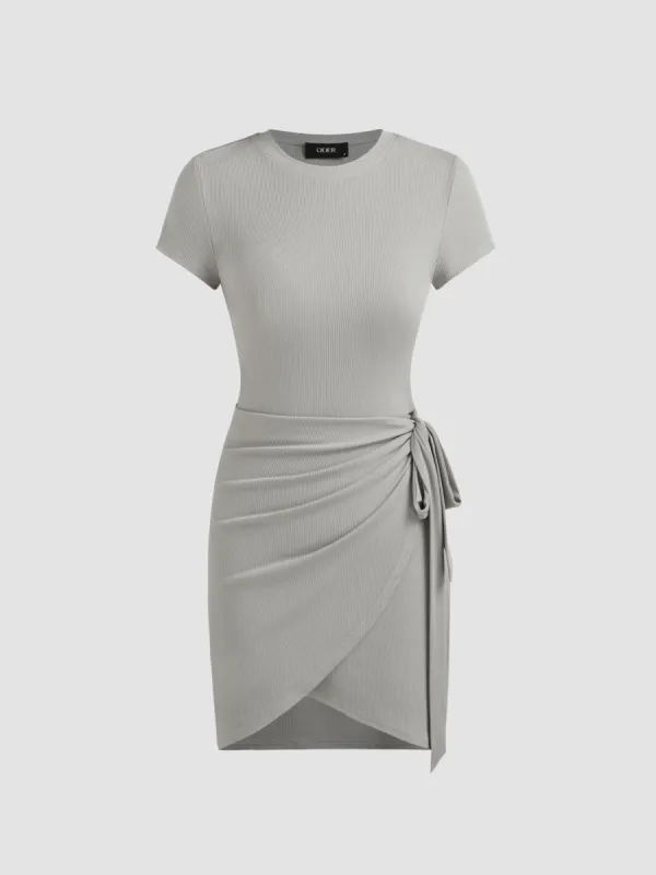 Round Neckline Solid Knotted Ruched Mini Dress sold by Cider