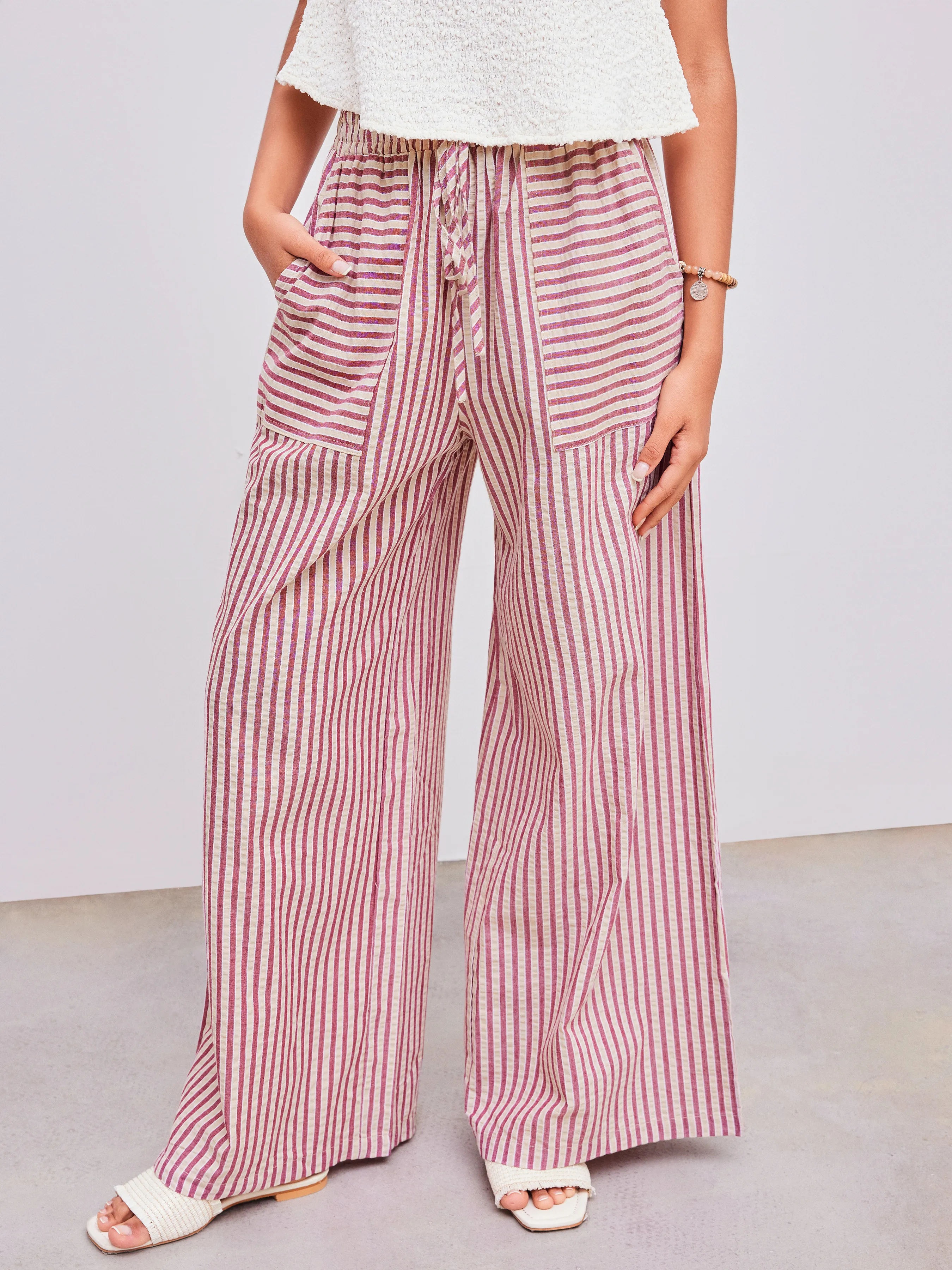 Woven Mid Rise Stripe Knotted Pocket Trousers sold by Cider