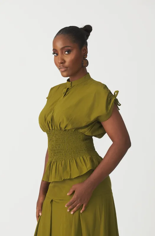 Oriri smocked blouse sold by Folklore Shop