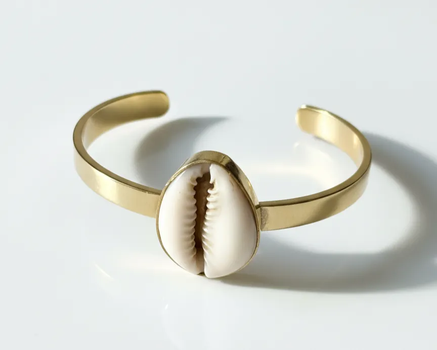 Mombasa Brass Cowrie Shell Bangle sold by Folklore Shop
