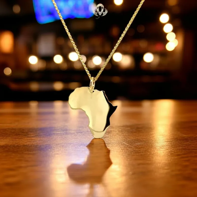 Gold Africa Pendant made by Folklore Shop
