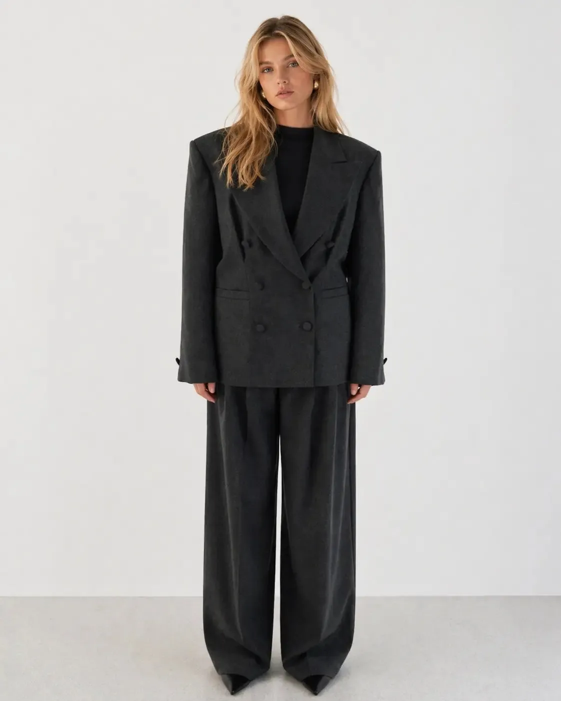 Double-breasted fitted blazer with subtle peplum silhouette sold by Folklore Shop