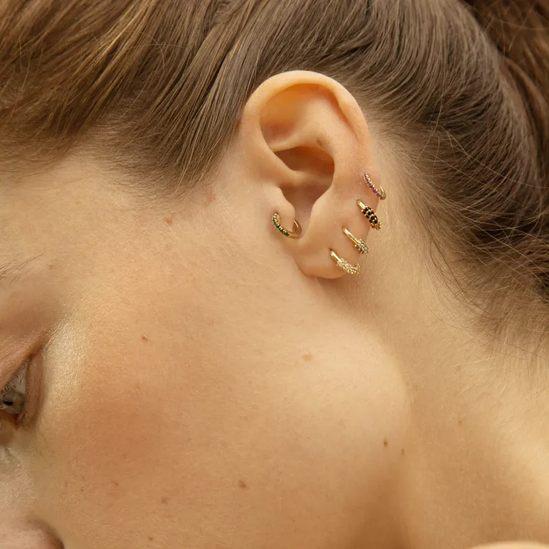 Oval Huggie With Black Onyx sold by Otiumberg