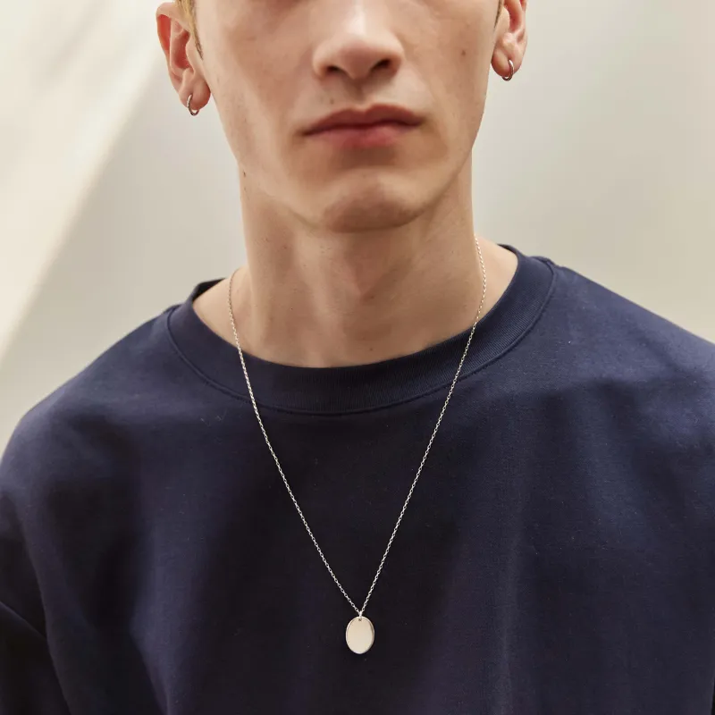 Men's Oval Pendant With Complimentary Hand Engraving made by Otiumberg