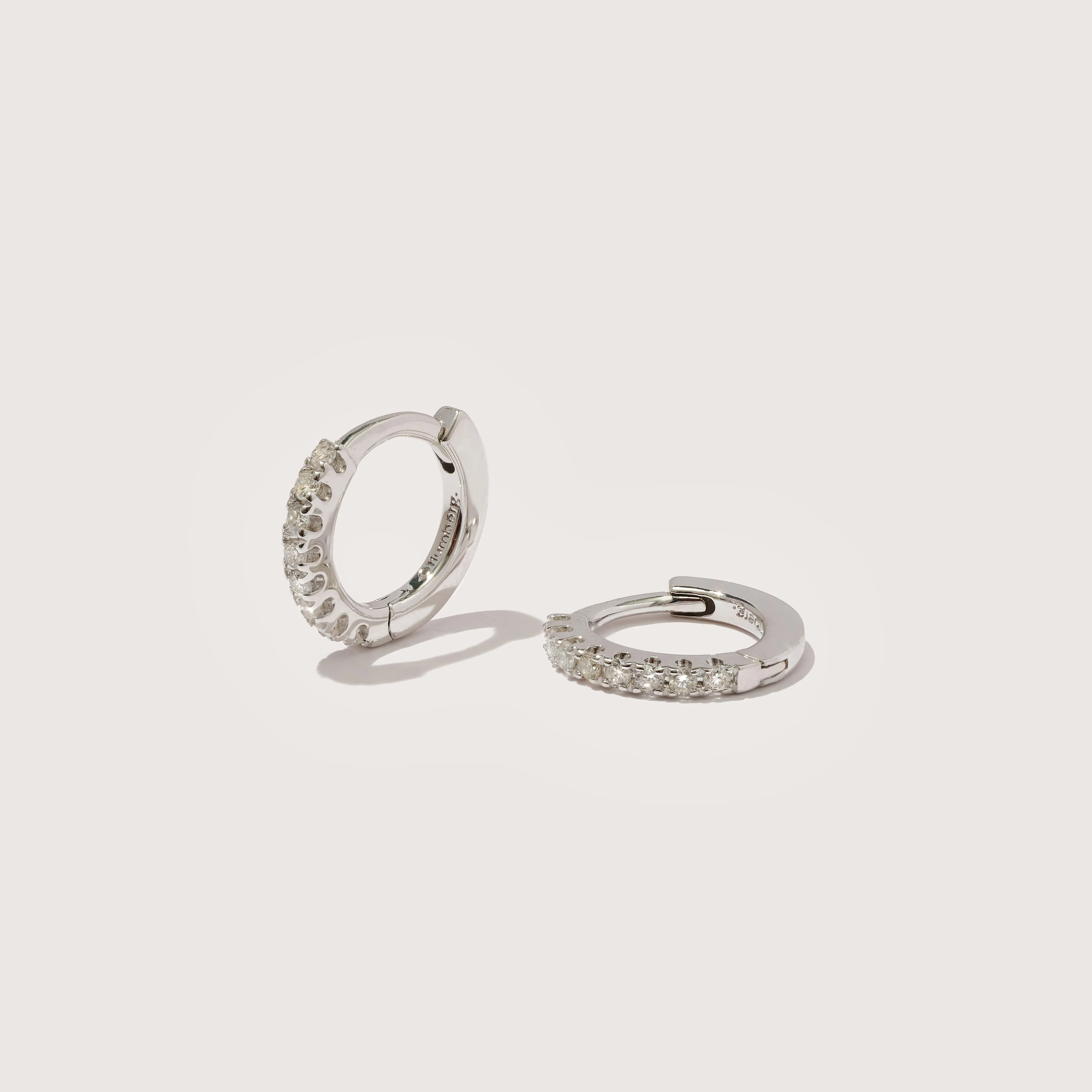 Small White Gold Diamond Huggie Hoops sold by Otiumberg