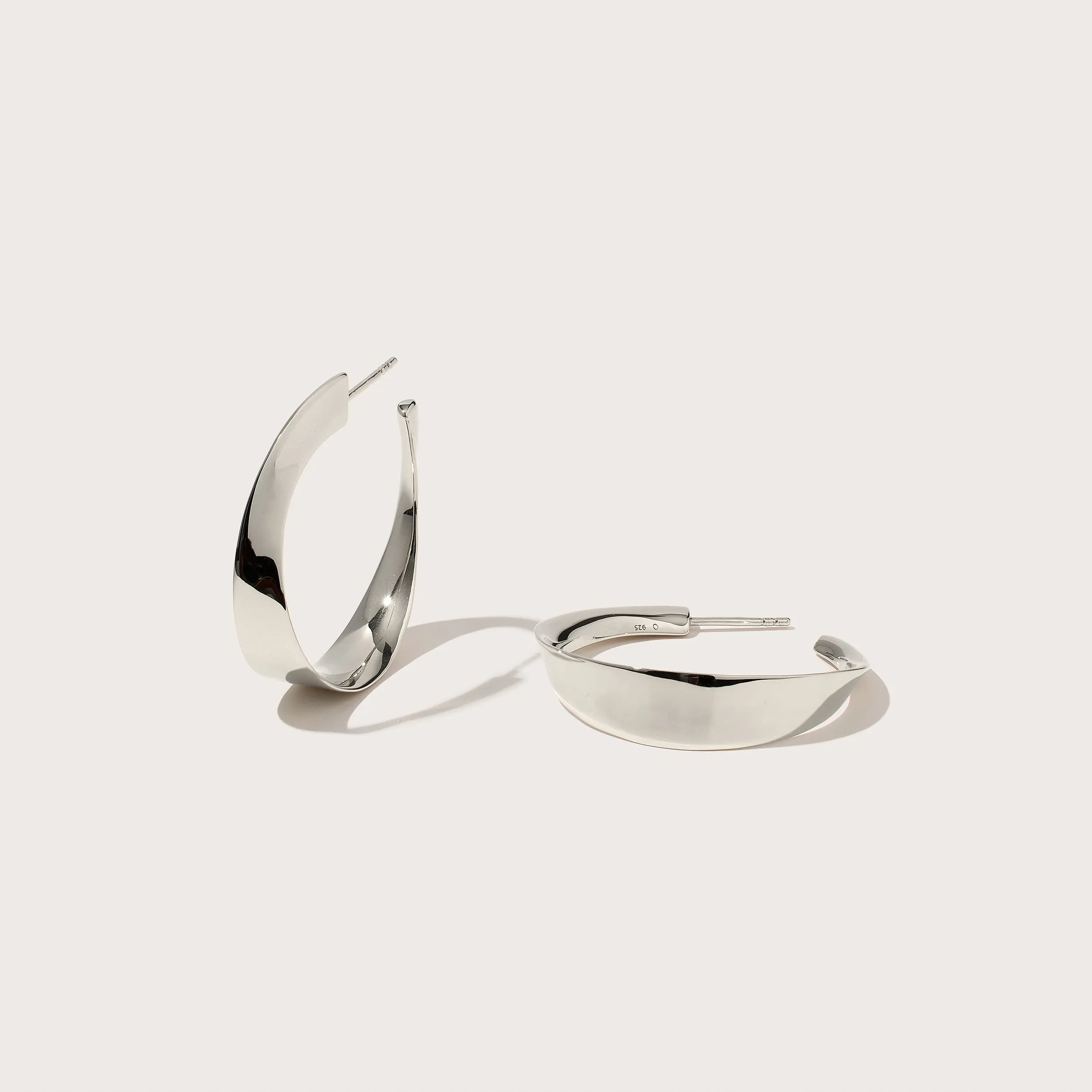Twisted Wave Hoops sold by Otiumberg