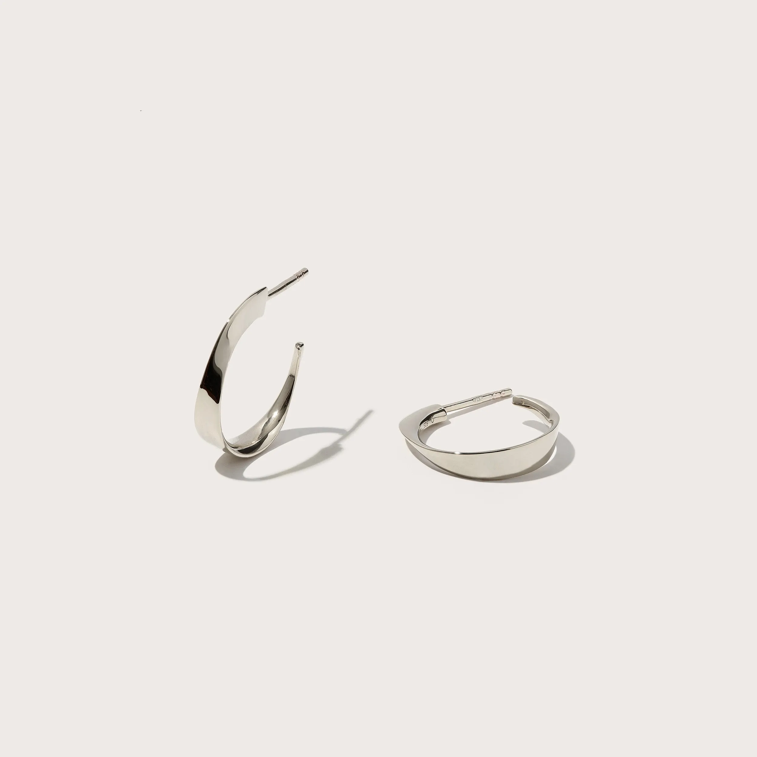 Small Twisted Wave Hoops sold by Otiumberg