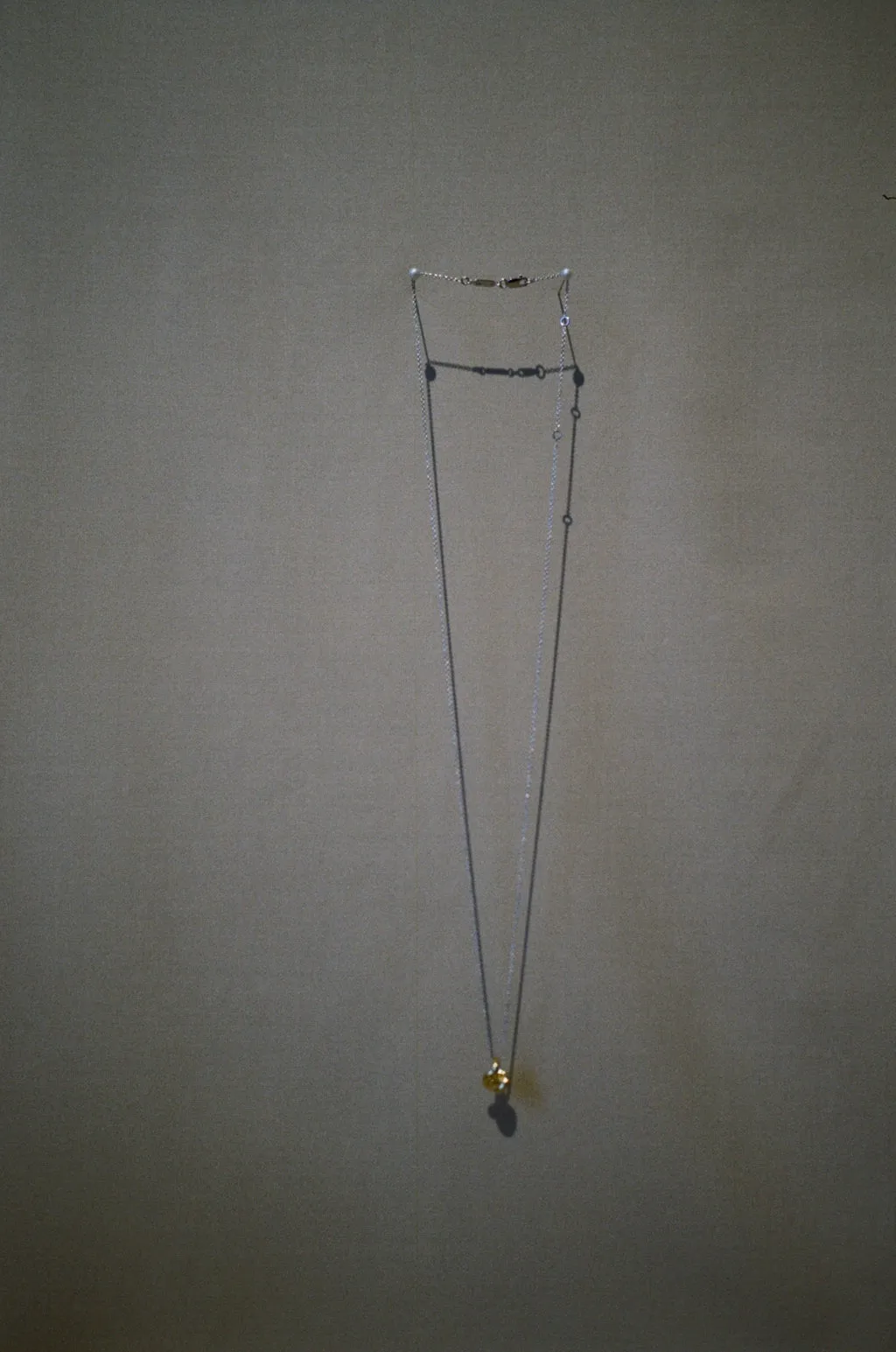 Mixed Metal Long Knot Necklace sold by Otiumberg product image thumbnail 4
