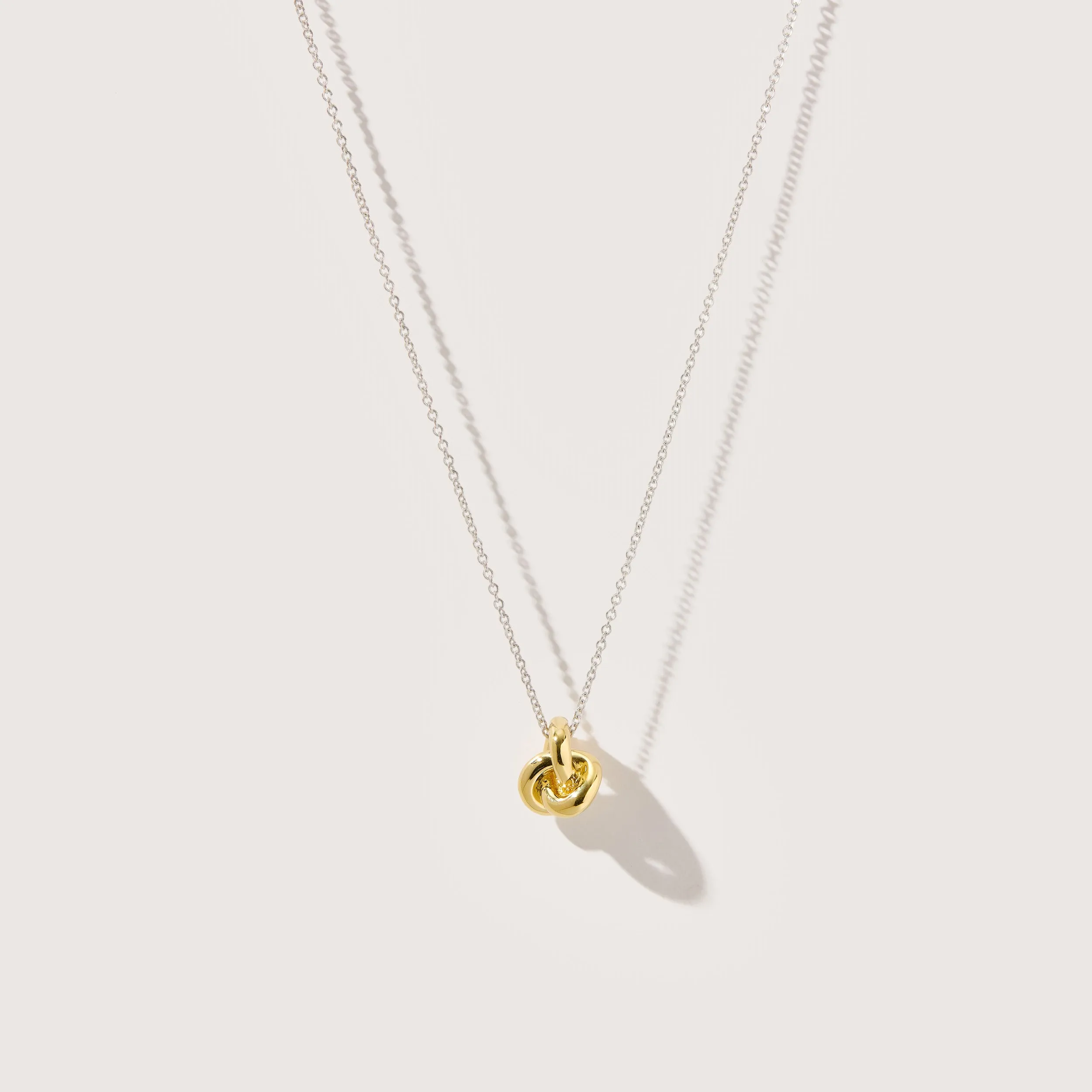 Mixed Metal Long Knot Necklace sold by Otiumberg