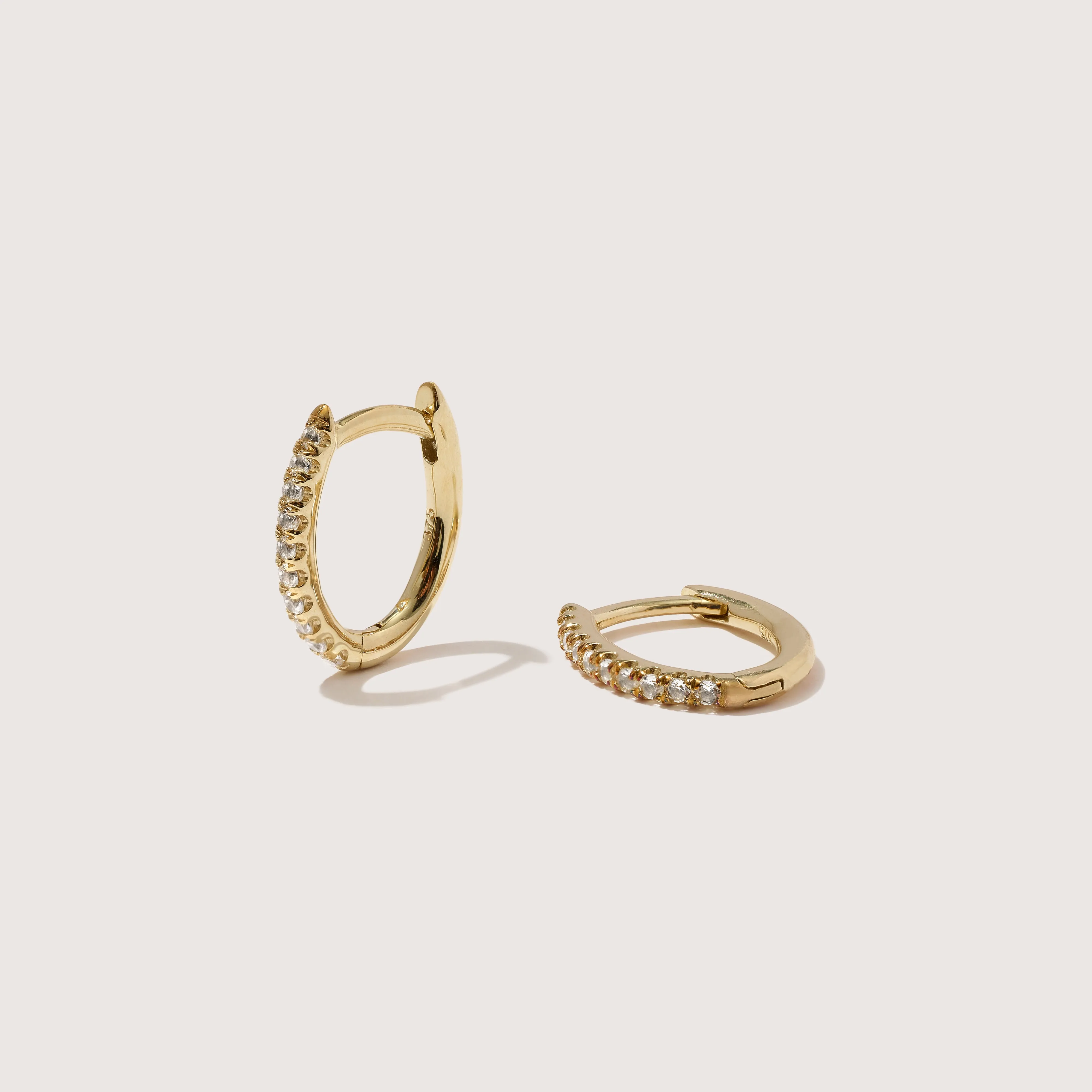 Mini Oval Hoops With White Topaz sold by Otiumberg