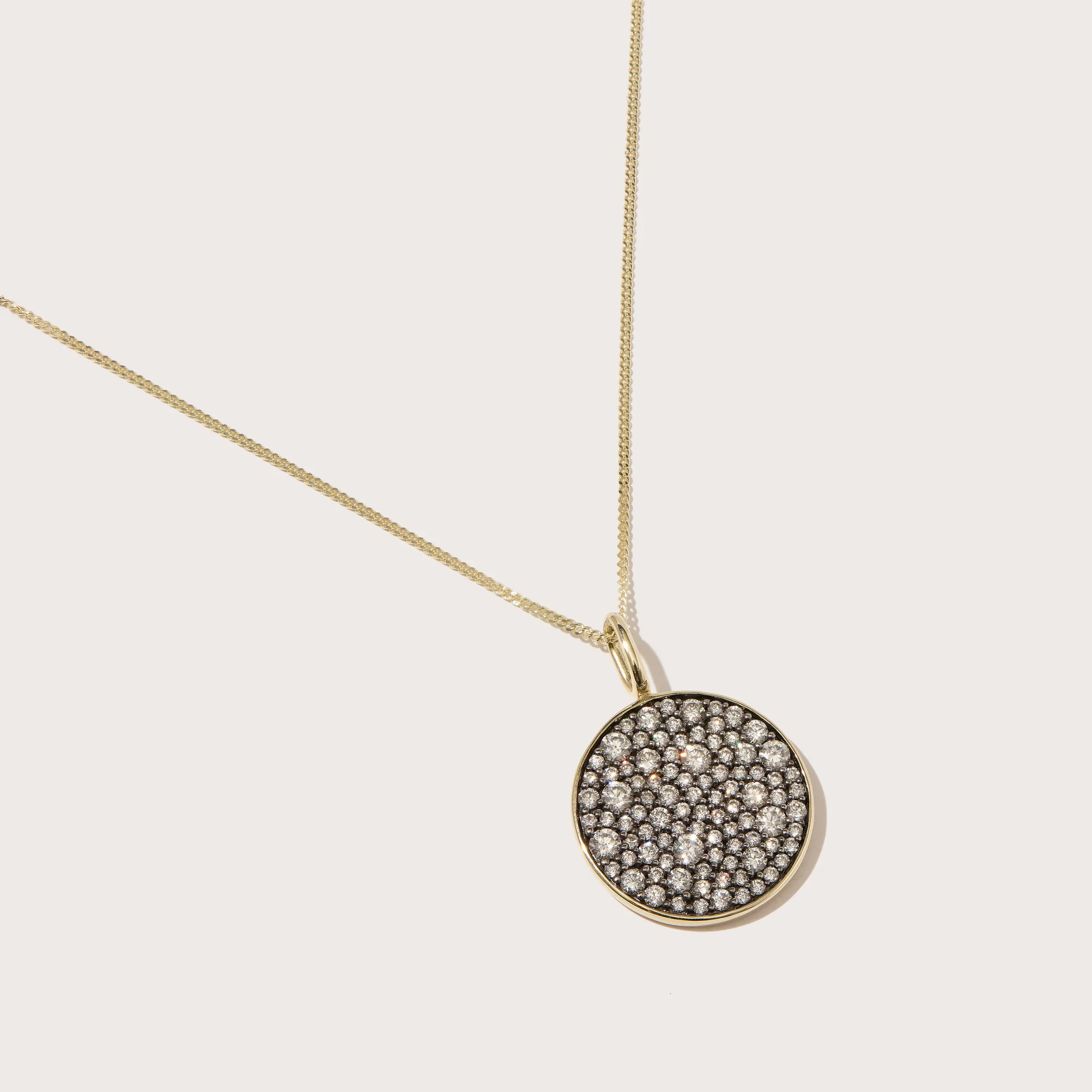 Midnight Diamond Disc Pendant sold by Otiumberg
