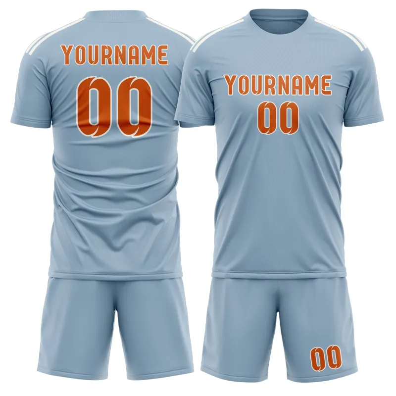 Custom Light Blue Orange Soccer Set made by Tailorly