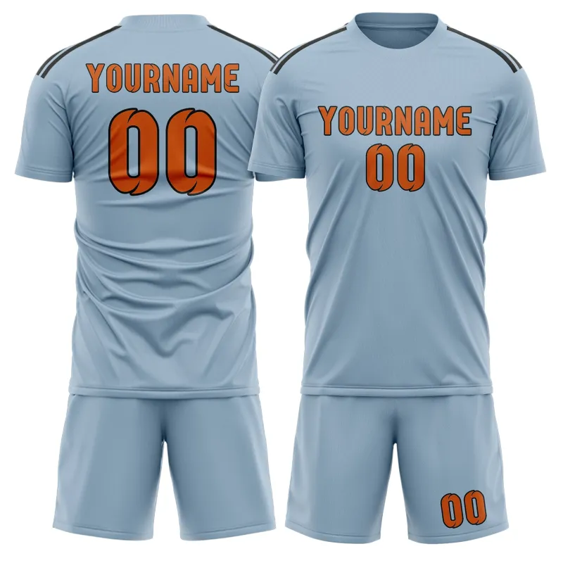 Custom Light Blue Orange Soccer Set made by Tailorly