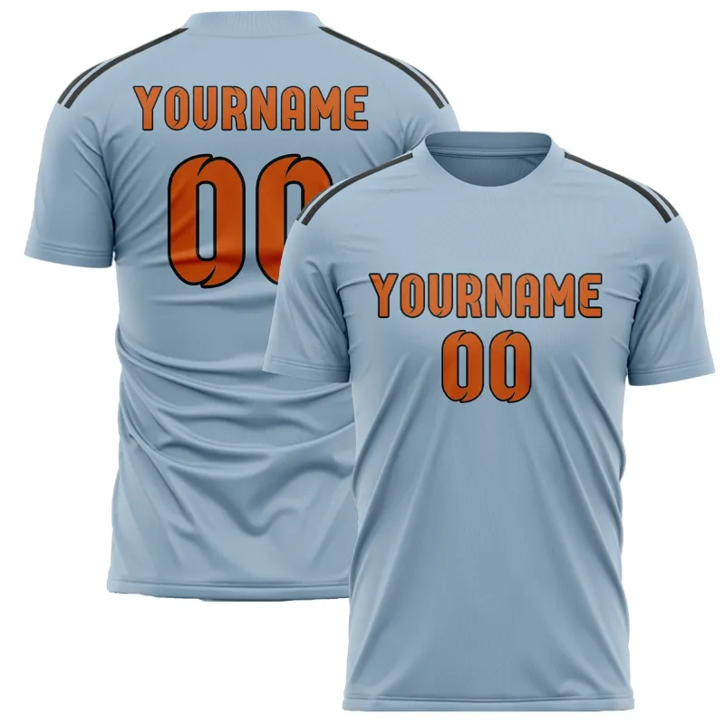 Custom Light Blue Orange Soccer Jersey made by Tailorly