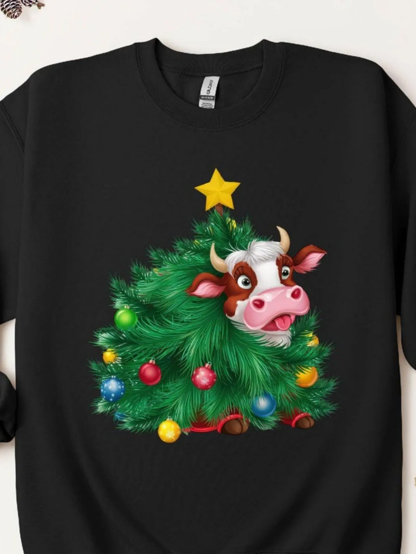 Tailorly Women's Printed Tee - Festive Pine Tree With Colorful Ornaments And Playful Cartoon Cow sold by Tailorly