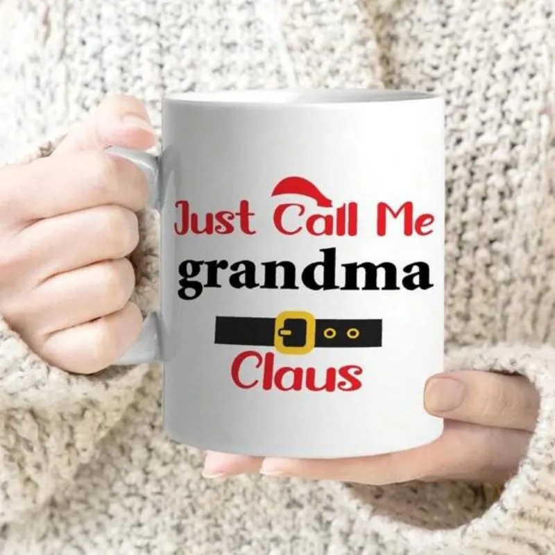 Tailorly White Ceramic 11 oz Mug - Just Call Me Grandma Claus Festive Red Holiday Hat Above A Black Belt With Gold Buckle Mug made by Tailorly