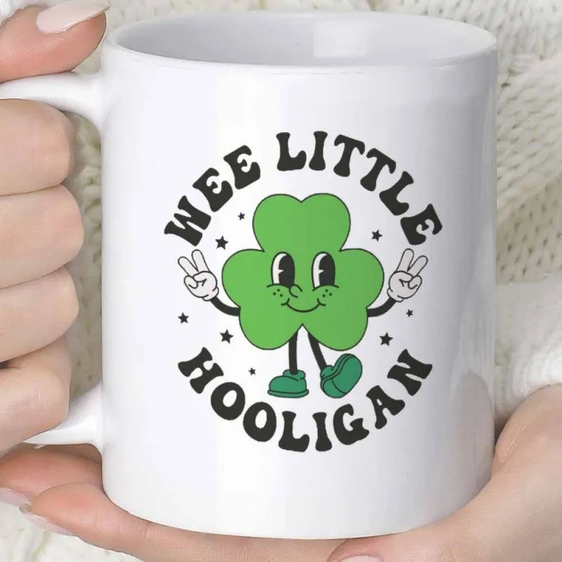Tailorly White Ceramic 11 oz Mug - Wee Little Hooligan Smiling Green Cartoon Character With White Gloves Making Peace Signs Shamrock made by Tailorly