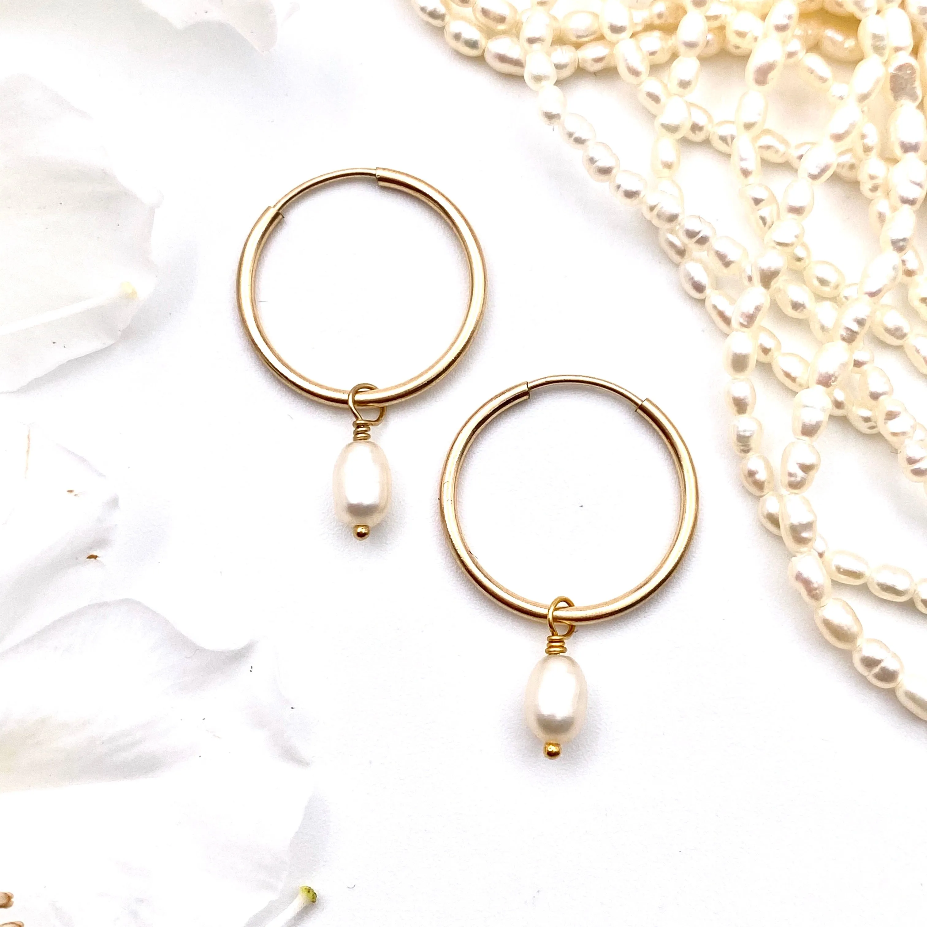 Classic pearl hoops sold by Ace of Swords