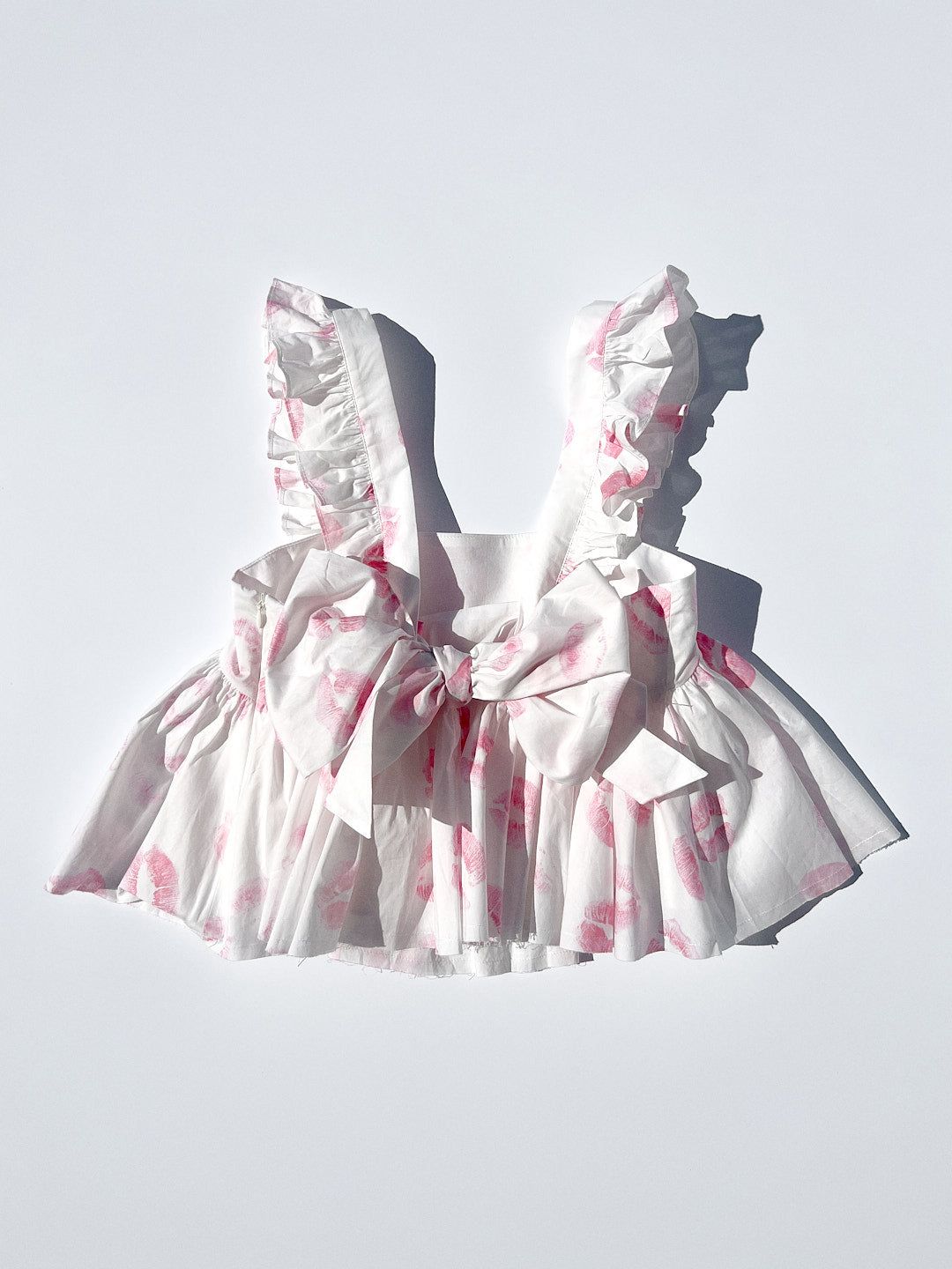 The Ruffle Apron Top - Kiss sold by Lisa Says Gah