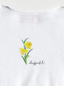 Alex Flower Tee - March Daffodil sold by Lisa Says Gah