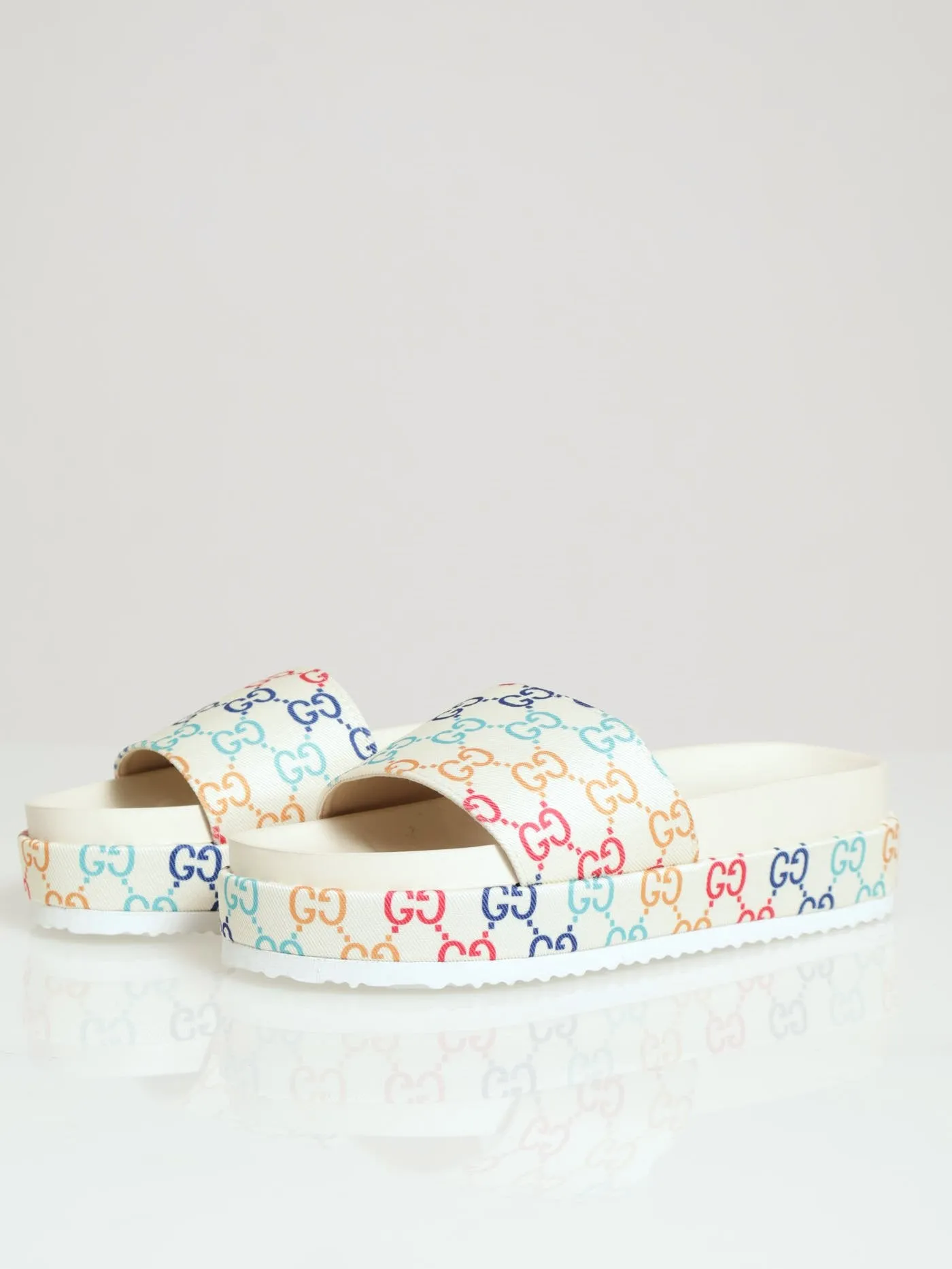 Monogram Printed Canvas Flatform Slide sold by Edgars
