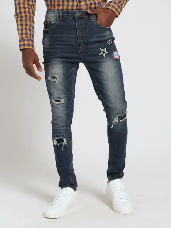 Boys Slim Badge Rip & Repar Denim Jeans - Indigo sold by Edgars