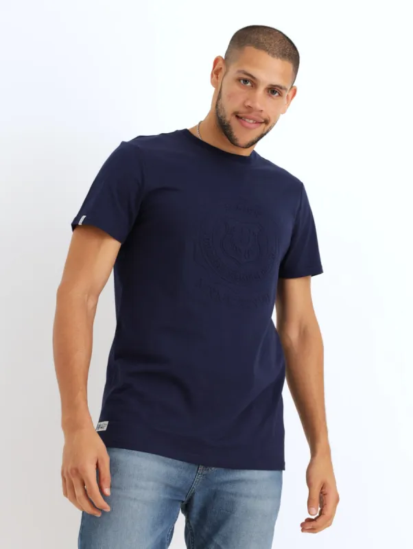 Men's Short Sleeve Badge Crew Tee - Navy sold by Edgars