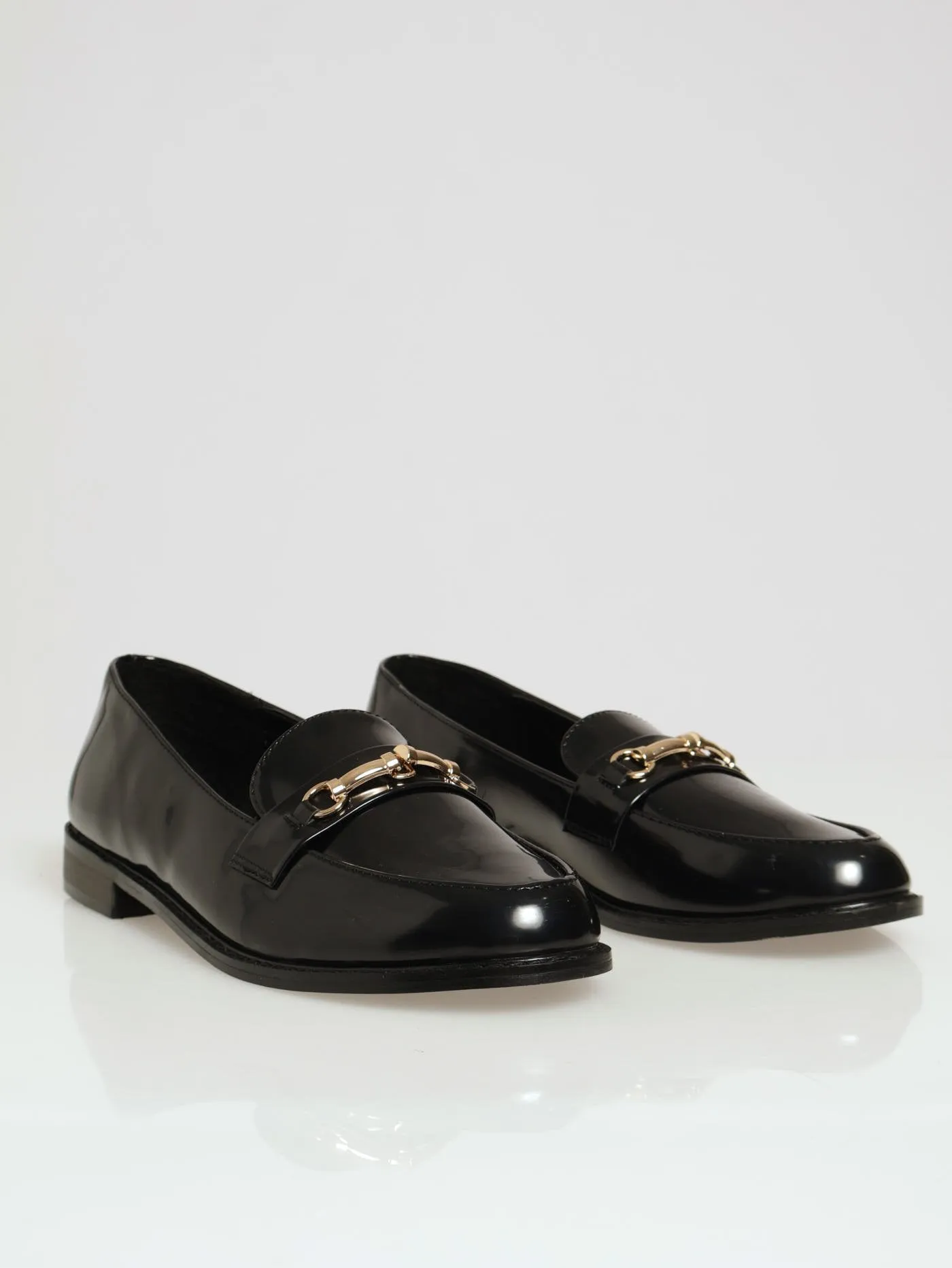 Almond Toe Metal Trim Loafer - Black sold by Edgars