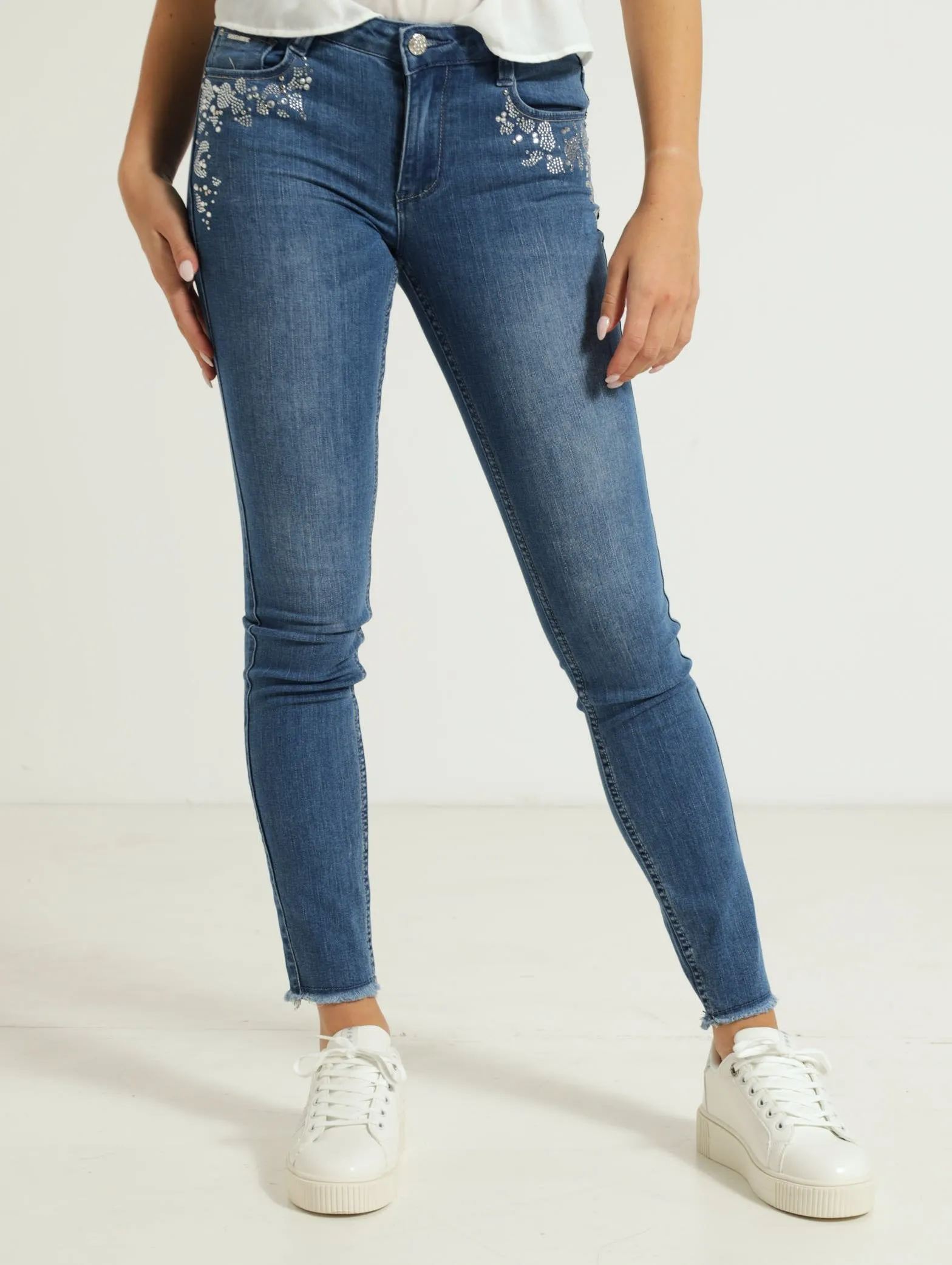 Mid Waist Skinny Jean With Bling Detail - Light Wash sold by Edgars