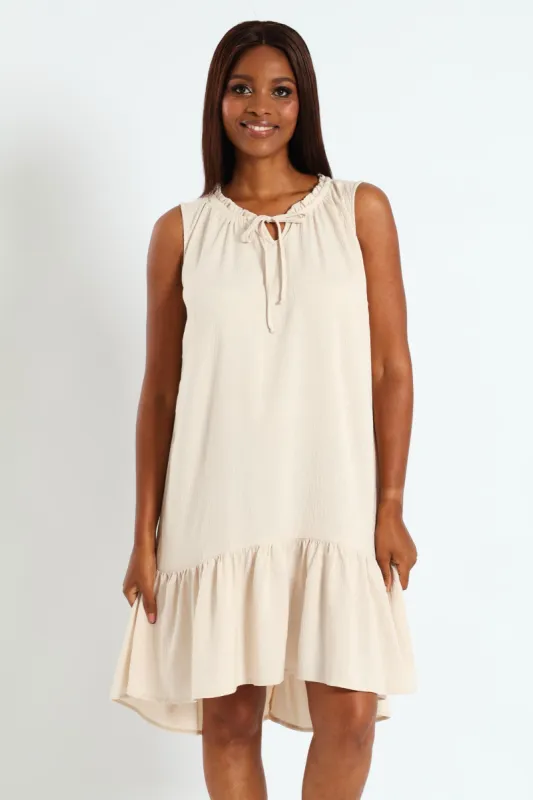 Frill Neck Drop Hem Dress - Light Stone sold by Edgars