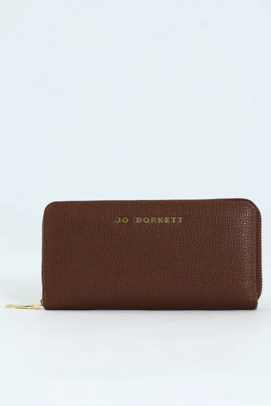 Carrie Pebble Raised Logo Ziparound Purse - Brown sold by Edgars