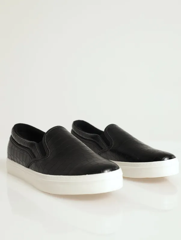 Slip On Street Sneaker With Metal Heel Insert sold by Edgars 