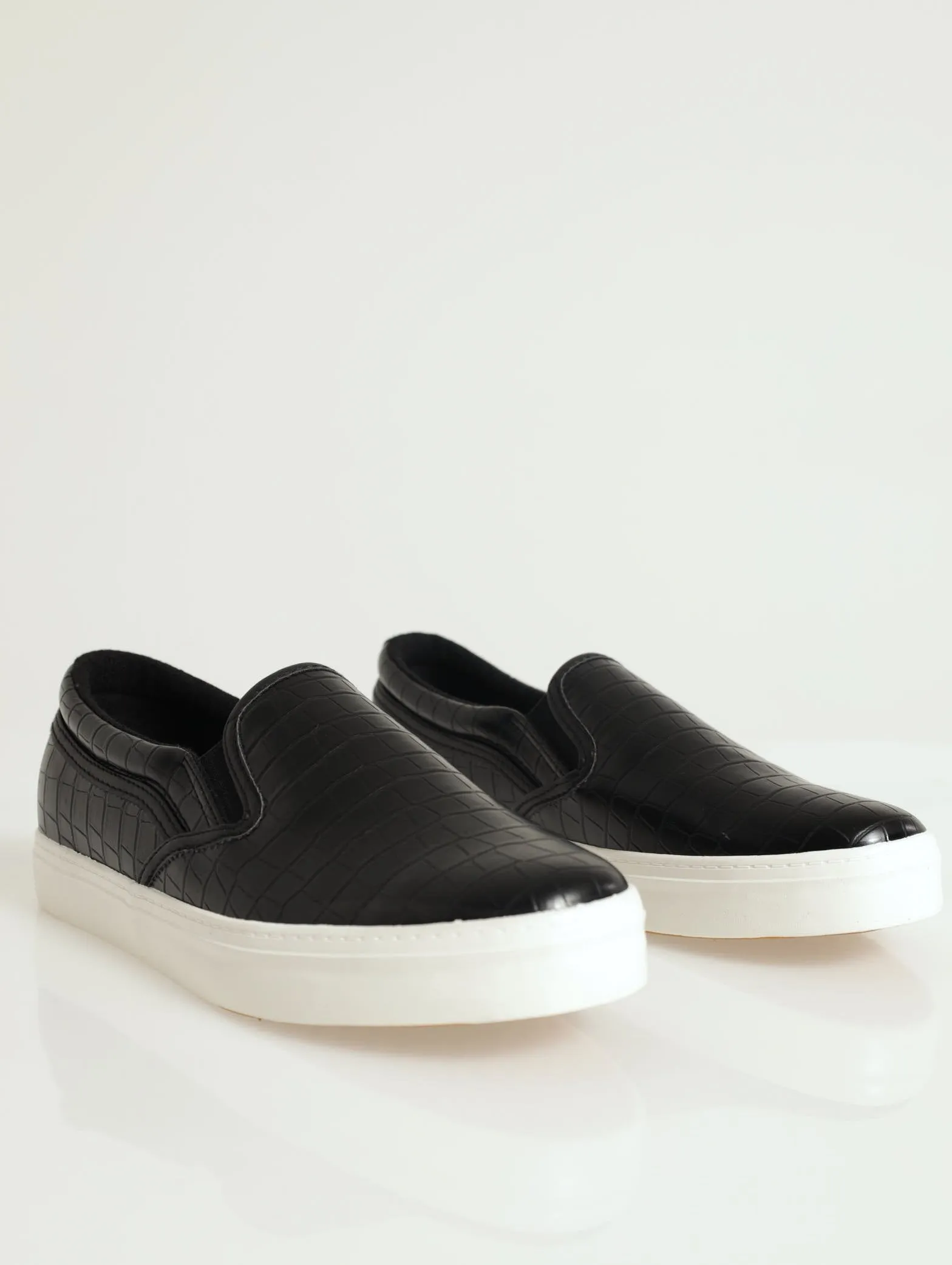 Slip On Street Sneaker With Metal Heel Insert sold by Edgars