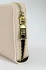 Charlotte Light Text Zip Around Purse - Cream sold by Edgars 