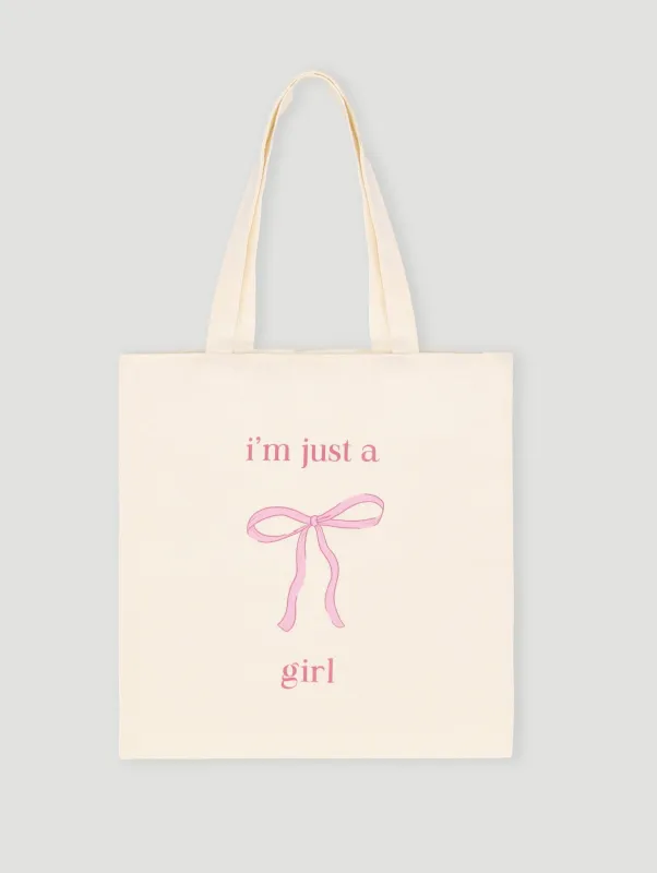 I'm Just a Girl Bow Printed Tote Bag sold by Edgars
