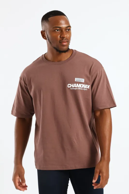 Pepper Corn Chamonix Puff Print Oversized Tee - Brown sold by Edgars