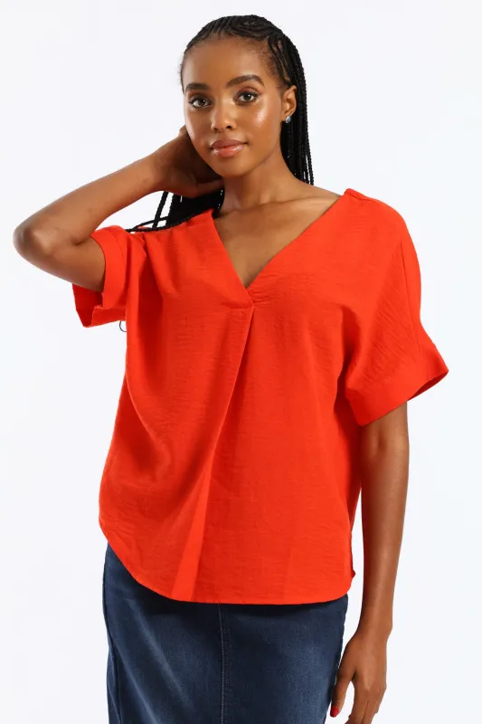 V-Neck Pleat Detail Curved Hem Linen Popover Top - Fiery Red sold by Edgars