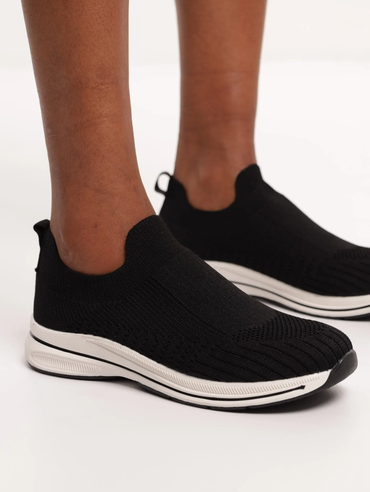 Ladies Knit Slip-On Sneaker - Black sold by Edgars