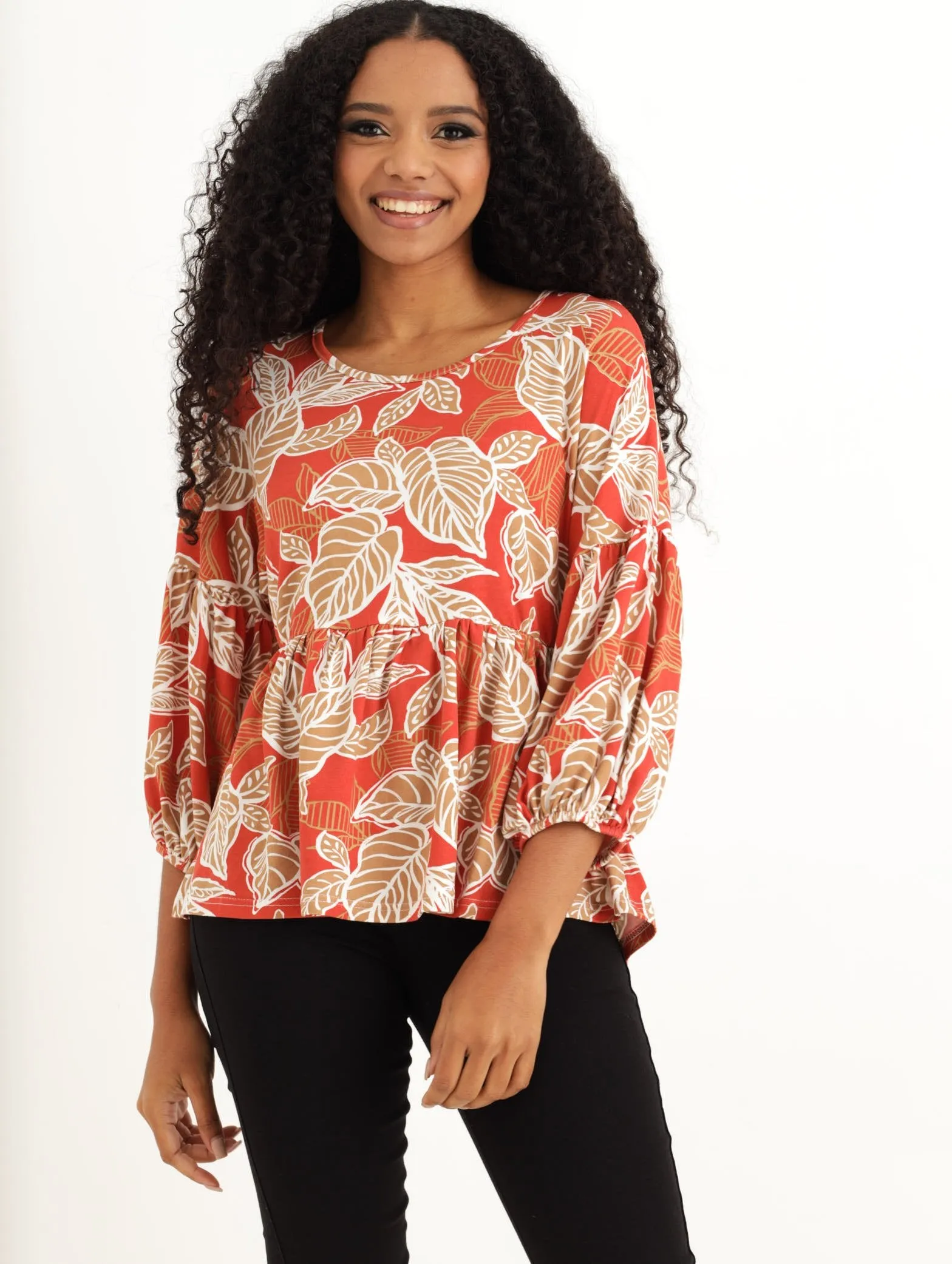 Ladies Floral Puff Sleeve Peplum Top sold by Edgars
