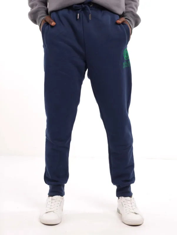 Men's Flock Emblem Track Pant - Navy sold by Edgars