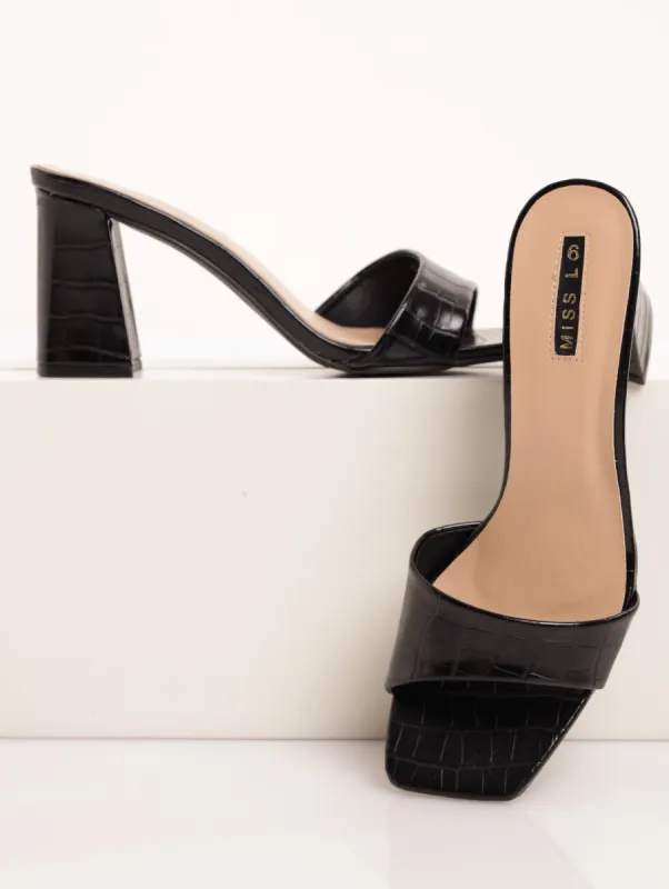 Ladies Asymetrical Croc Embossed Flared High Heel - Black sold by Edgars