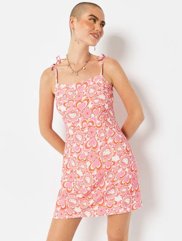 Hello Kitty x Skinnydip Psychedelic Flower Tie Strap Mini Dress sold by Skinnydip London