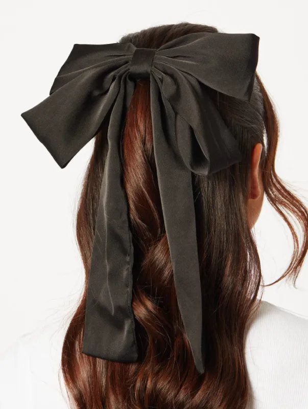 Satin Oversized Bow Hair Clip in Black sold by Skinnydip London