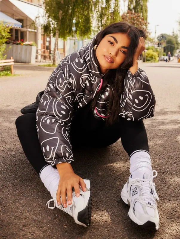 Warped Happy Face Hooded Puffer sold by Skinnydip London