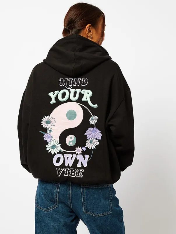 Mind Your Own Vibe Hoodie in Black sold by Skinnydip London