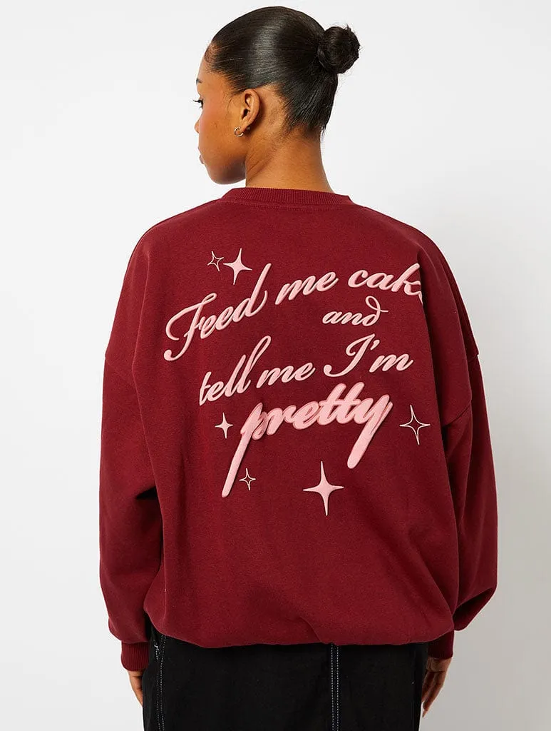 Feed Me Cake Sweatshirt in Burgundy sold by Skinnydip London