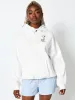 Peanuts x Skinnydip Snoopy Mixed Character Hoodie in Ecru sold by Skinnydip London